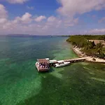 Accommodation On A Coral Island With Turquoise Sea