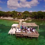 Accommodation On A Coral Island With Turquoise Sea