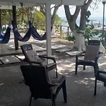 Accommodation On A Coral Island With Turquoise Sea