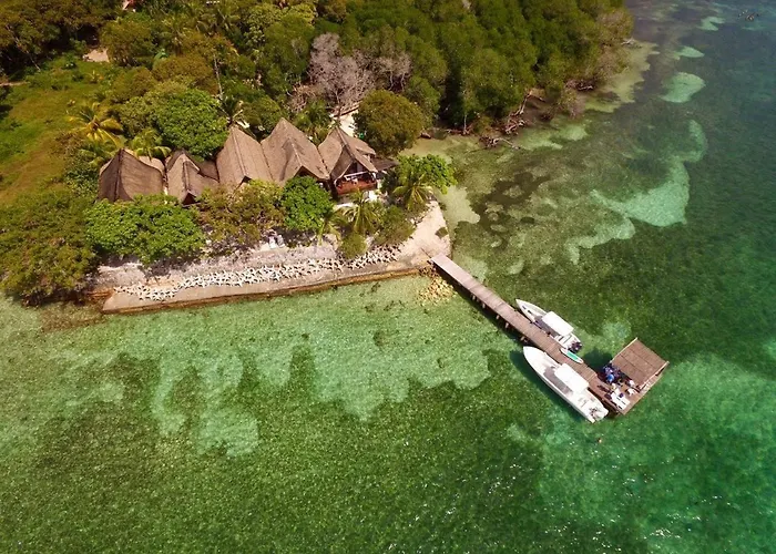Accommodation On A Coral Island With Turquoise Sea